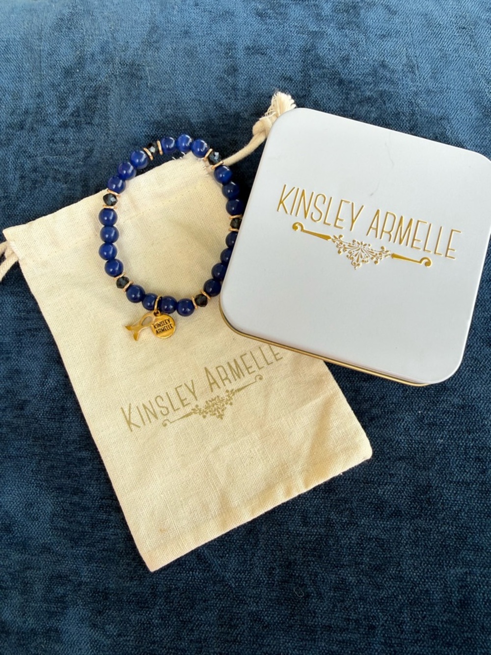 Kinsley Armelle Navy Beaded Stretch Bracelet with Gold Charm and gold fish charm